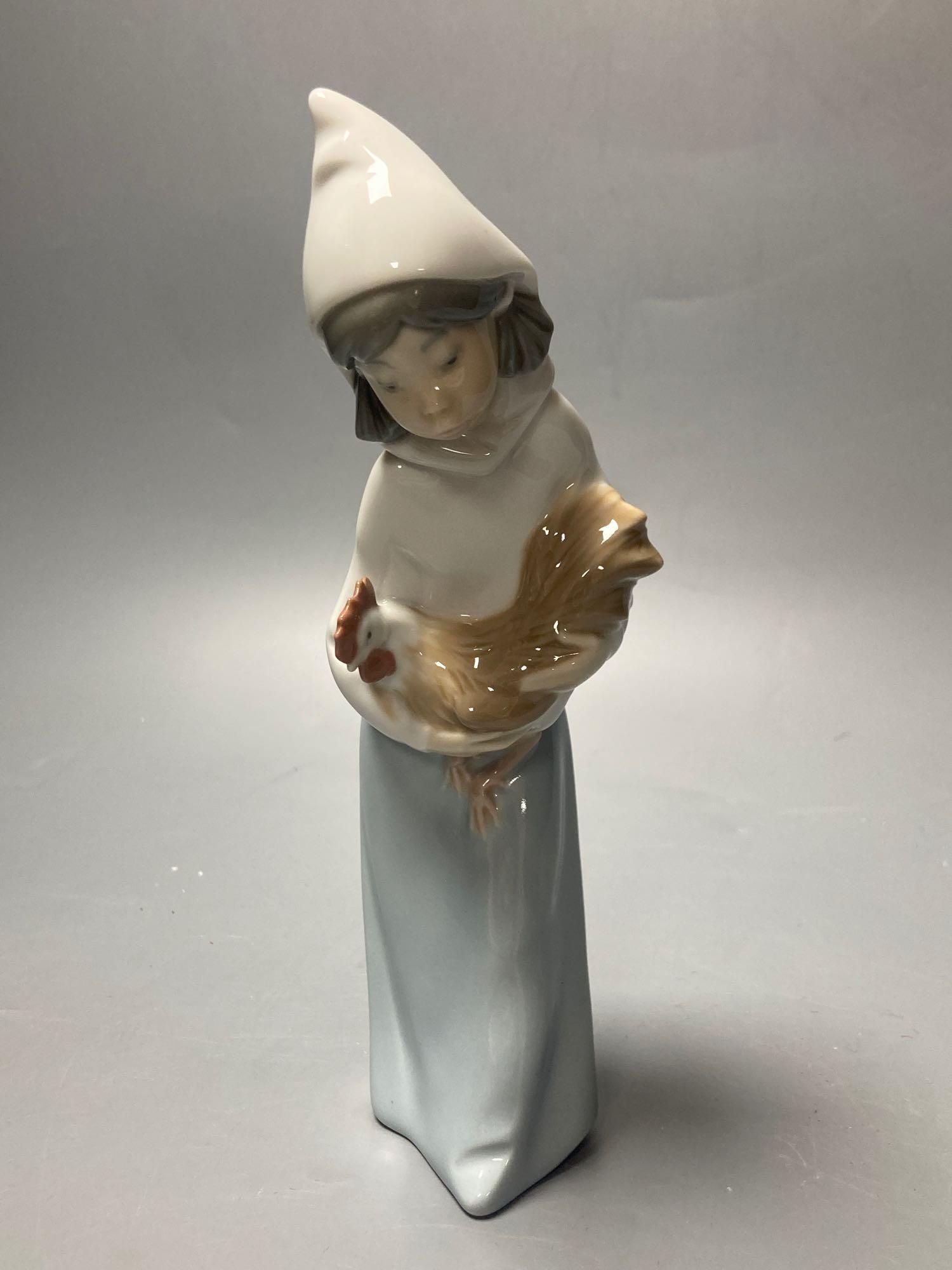 Three Lladro figures, largest 29cm, A Nao seated cherub and a Beswick horse